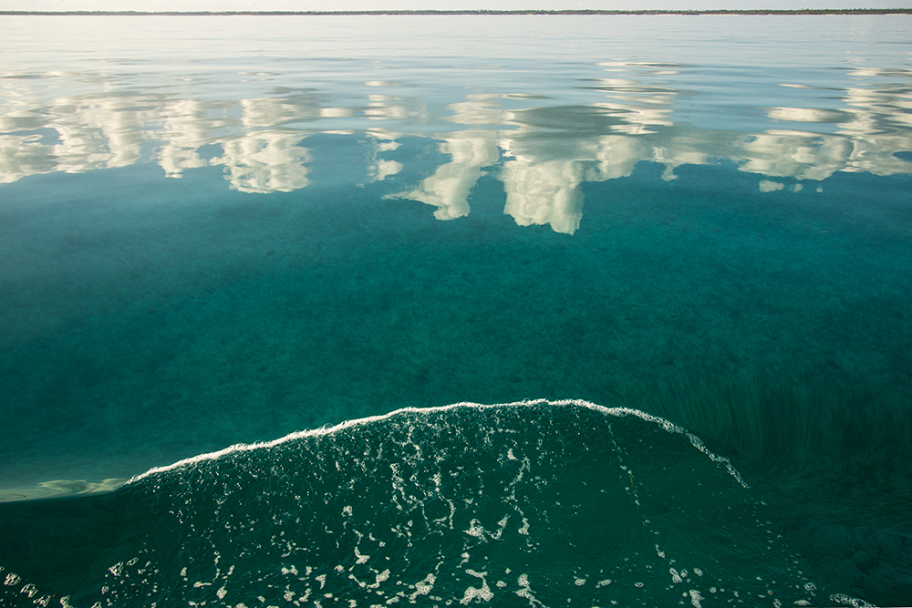 clouds reflected in water leaving TC
